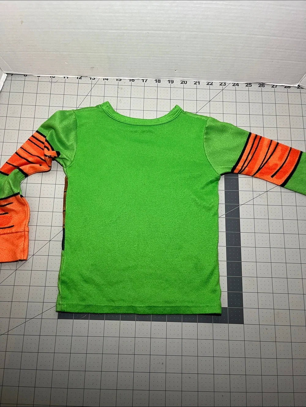 Kids Green Turtle Shell Pajama Top with Orange Sleeve Accents
